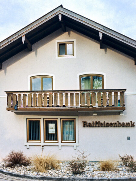 Fine art picture showing a Bavarian house watching the neighbourhood