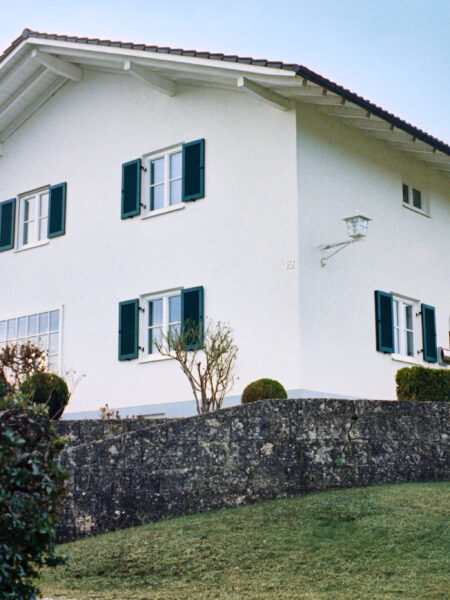 Fine art picture showing a Bavarian house watching the neighbourhood